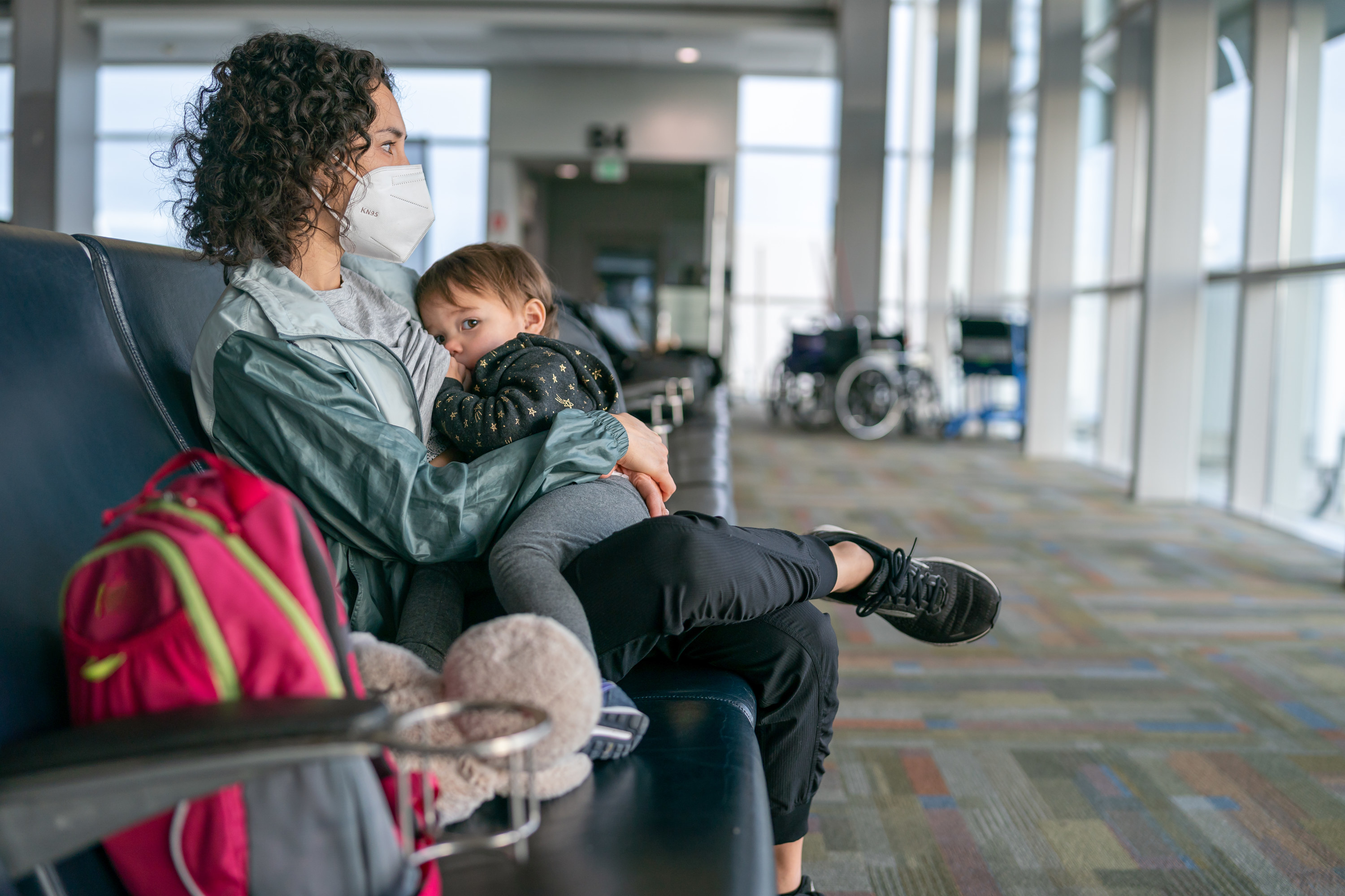 Woman holding baby in the airport