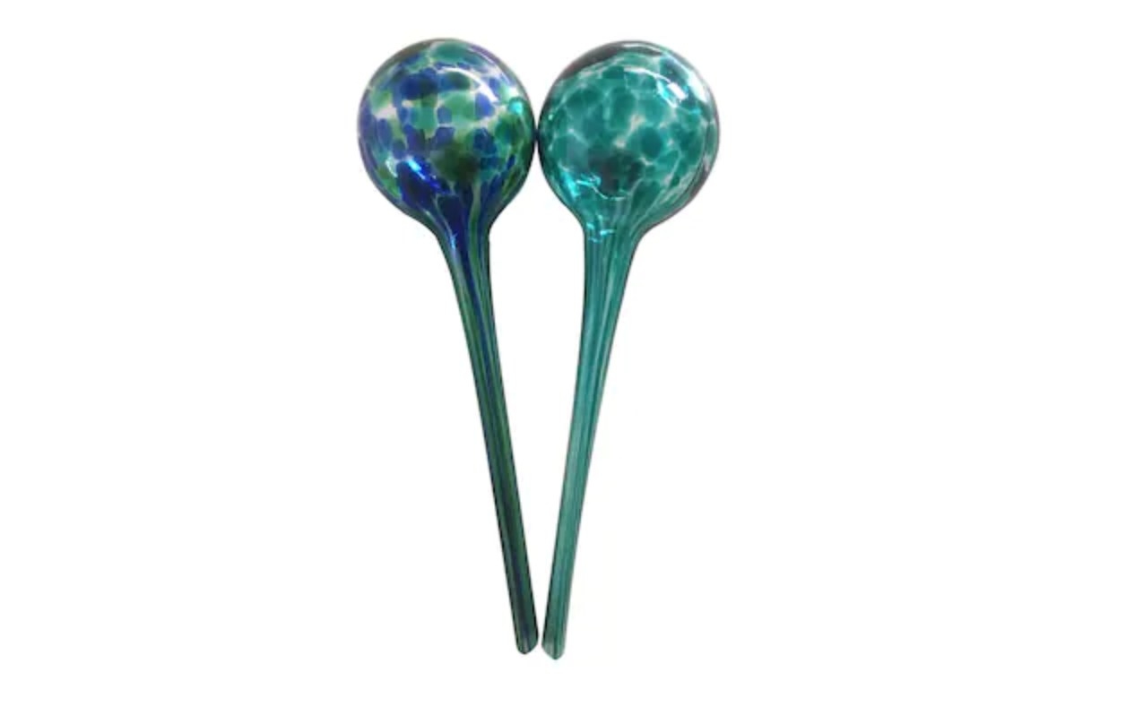 the Ornate handmade recycled glass watering stakes for small indoor or outdoor plant pots,