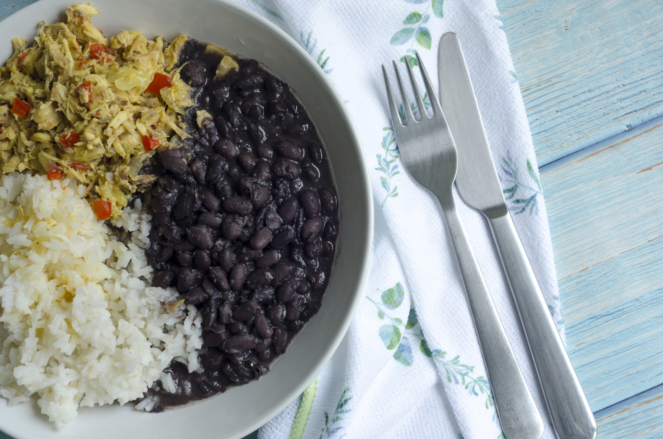 Black beans with rice and shredded chicken.