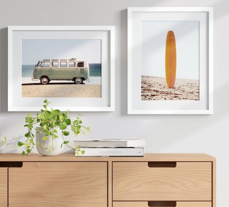 Beach framed prints hanging on white wall