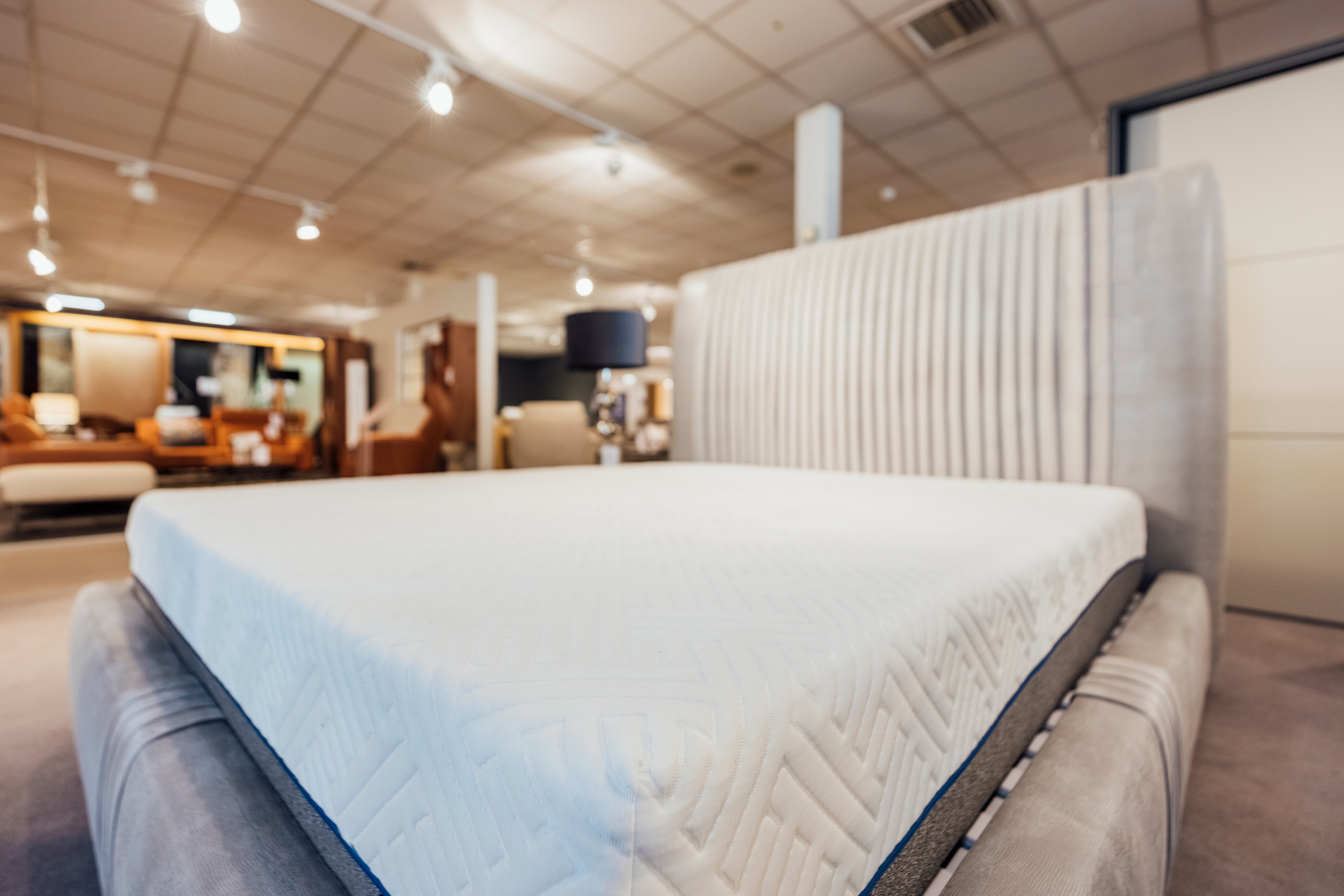 a bare mattress in a store