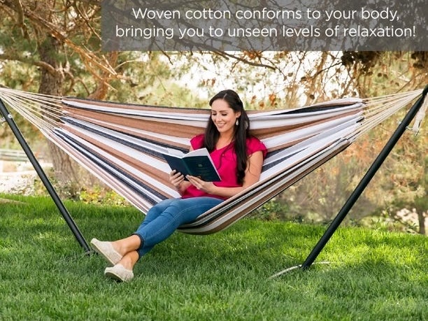 Person reading a book while sitting in the hammock