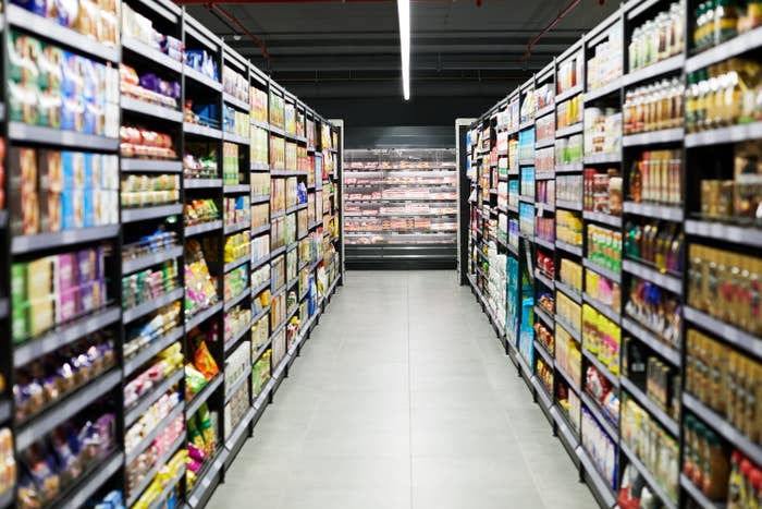 an empty aisle in a grocery store