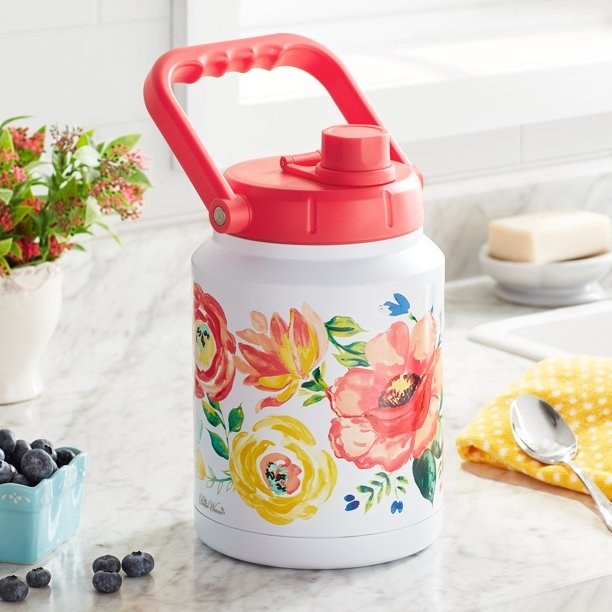 Floral print half gallon jug sitting on a kitchen counter