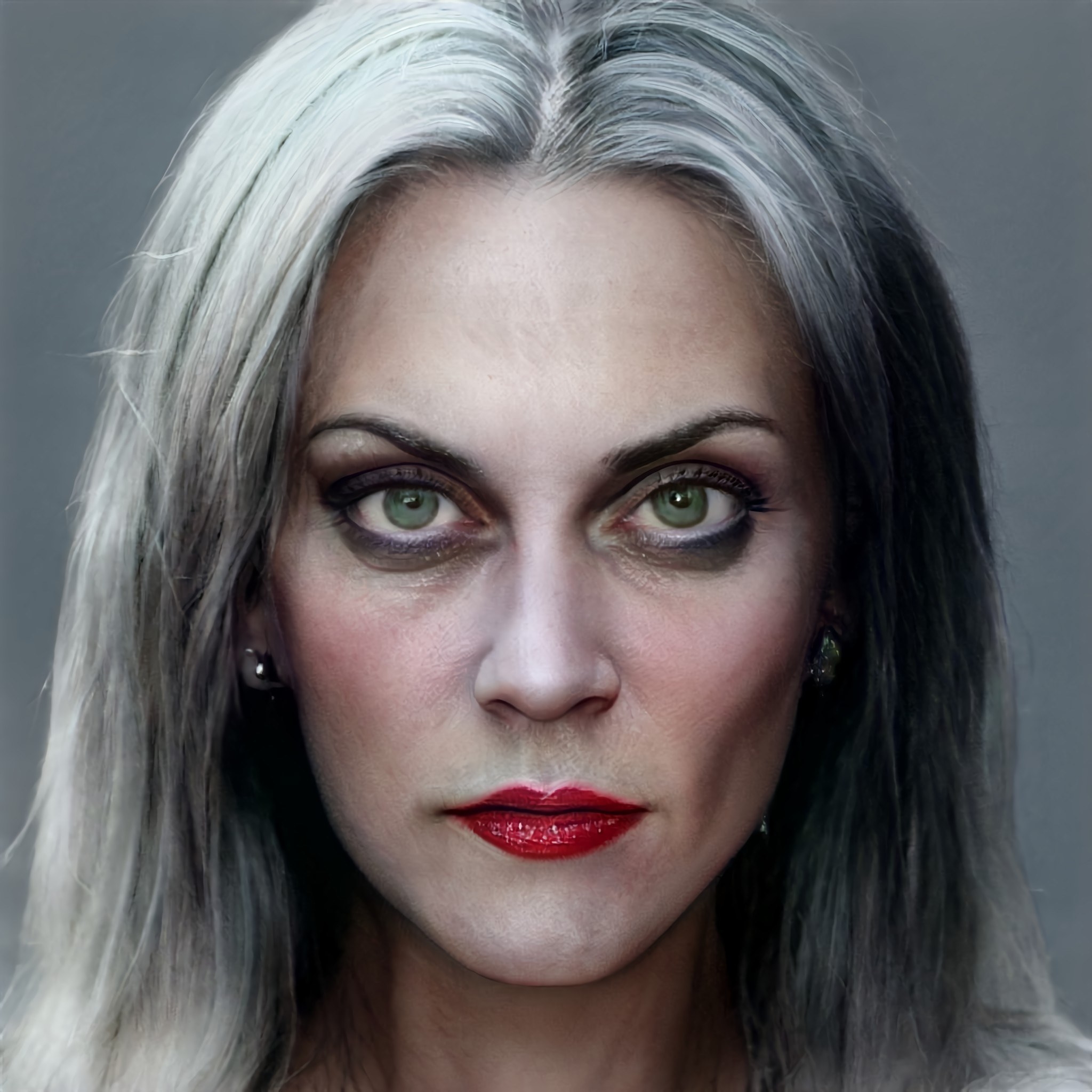cruella with big eyes and white-grey hair
