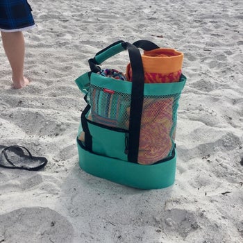 reviewer's photo of the beach bag in turquoise