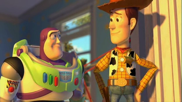 woody and buzz smiling at each other in andy&#x27;s bedroom