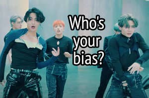 Ateez group is posing in a music video labeled, "Who's your bias?"