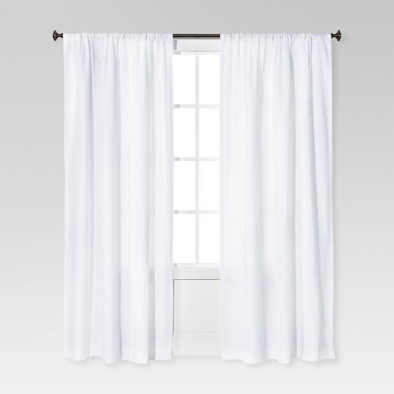 Two of the curtain in white on a window