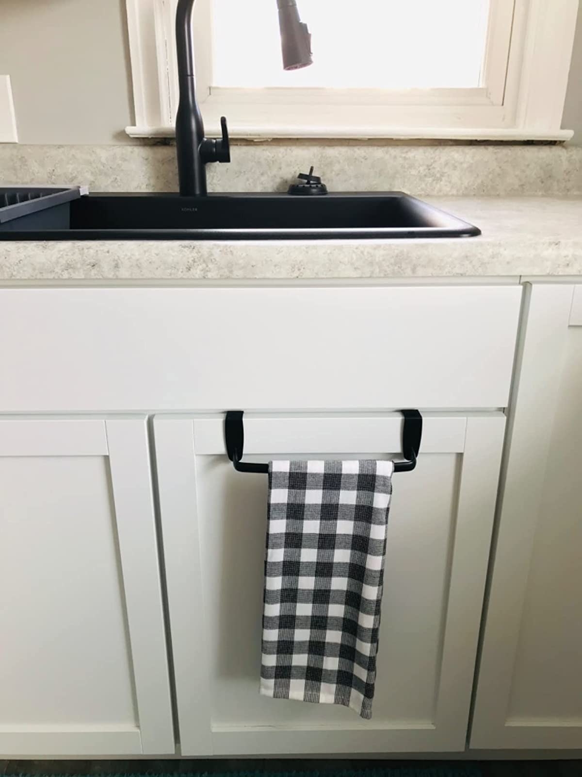 Reviewer image of checkered towel hanging on bar in a kitchen