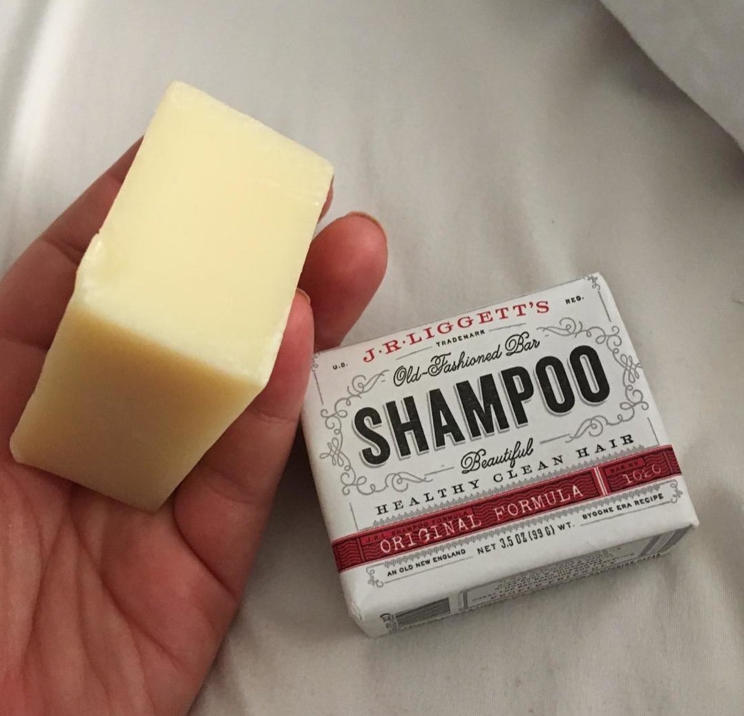 Reviewer holding shampoo bar
