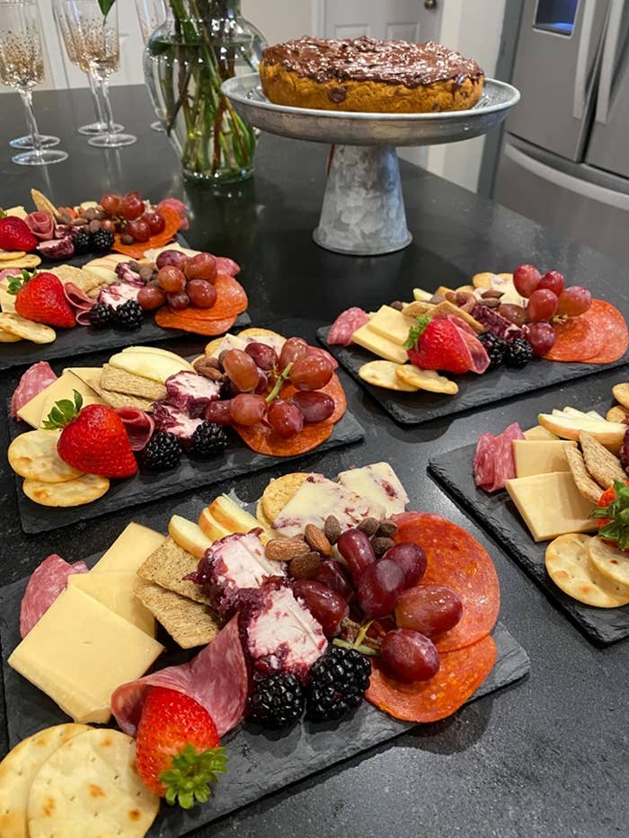 Reviewer image of slate boards arranged with charcuterie