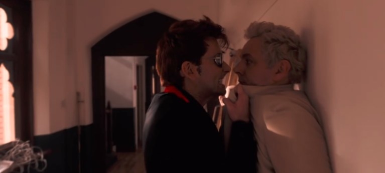 Crowley angrily pinning Aziraphale up against a wall.