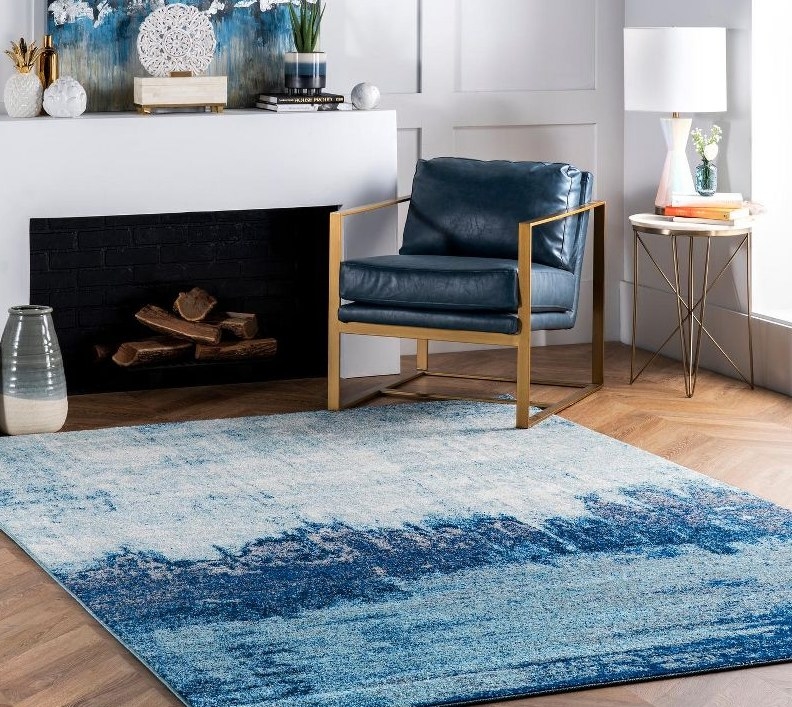 Blue abstract rug in living area