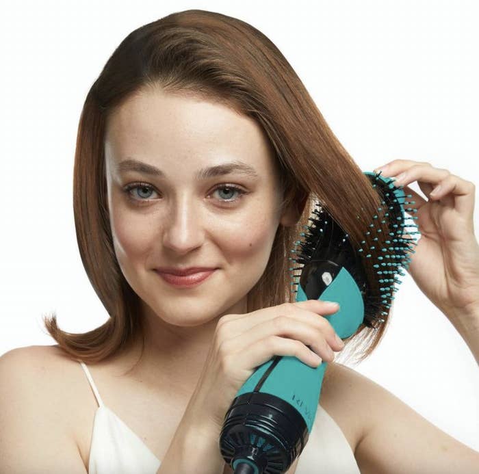 A person using a heat styling tool