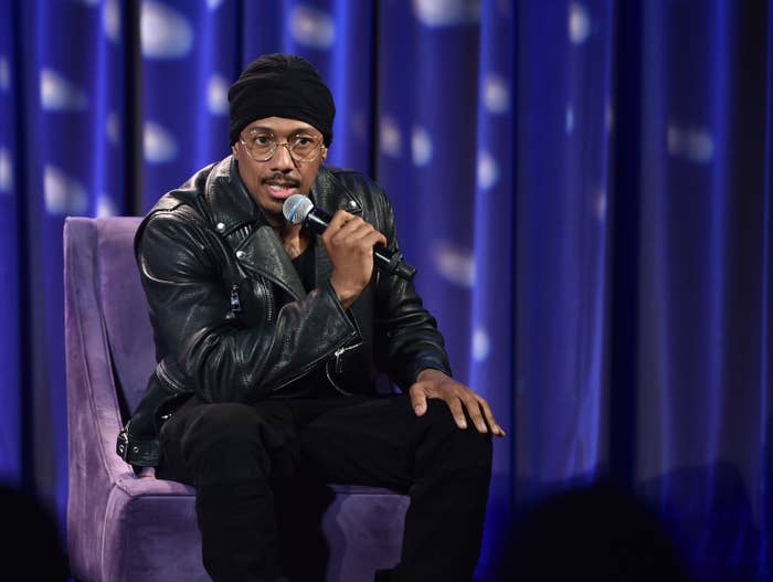 Nick Cannon onstage with a microphone