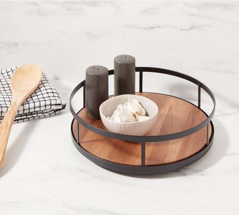 Round spice rack on marble countertop