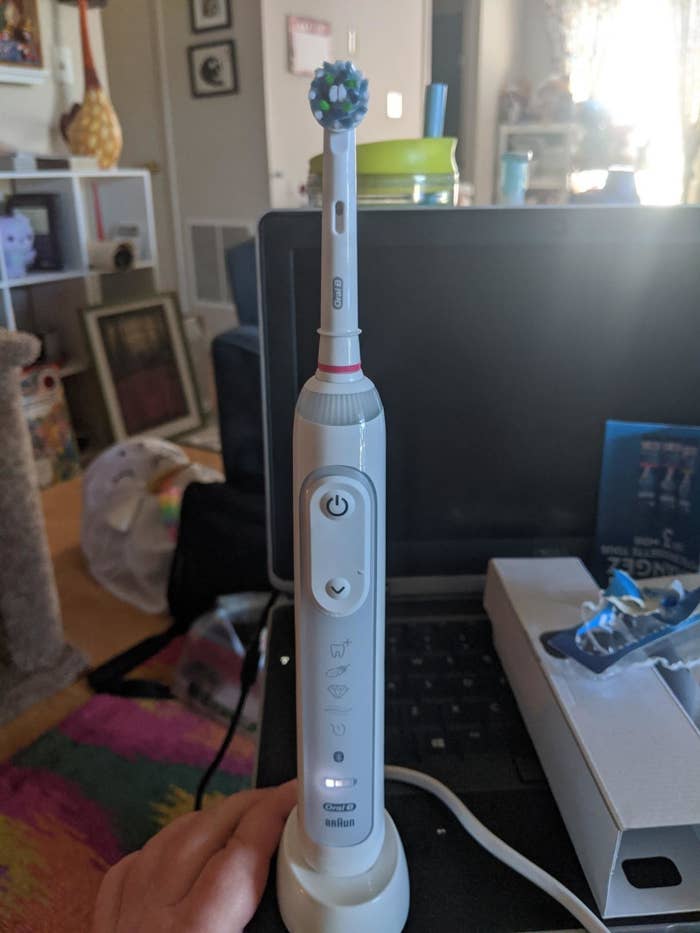 reviewer&#x27;s photo of the white toothbrush