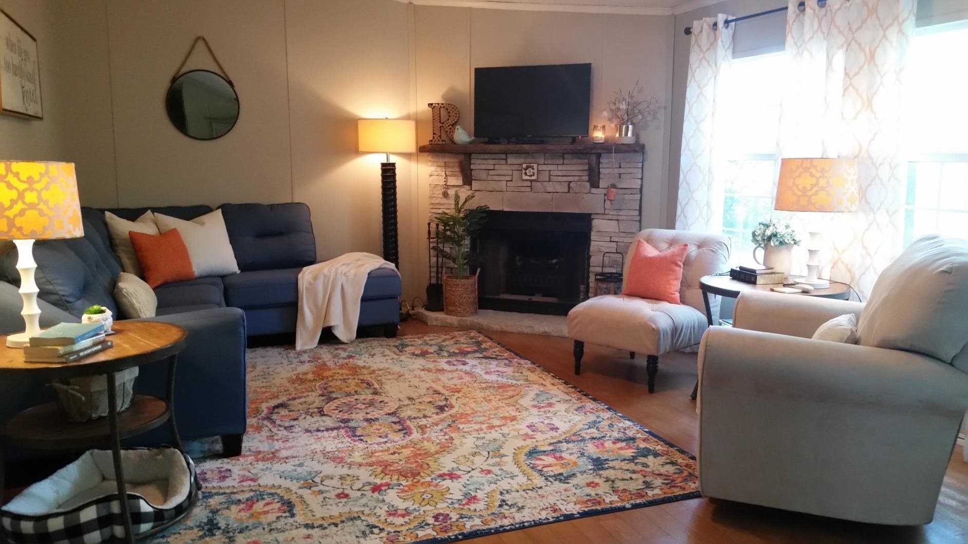 Reviewer&#x27;s photo of the rug in their living room