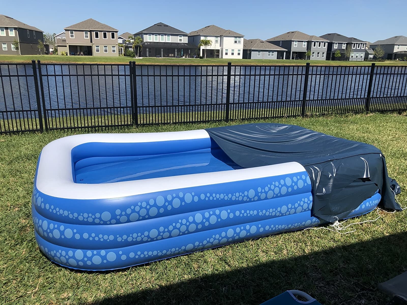 Reviewer&#x27;s photo of the rectangular pool with cover half draped over it