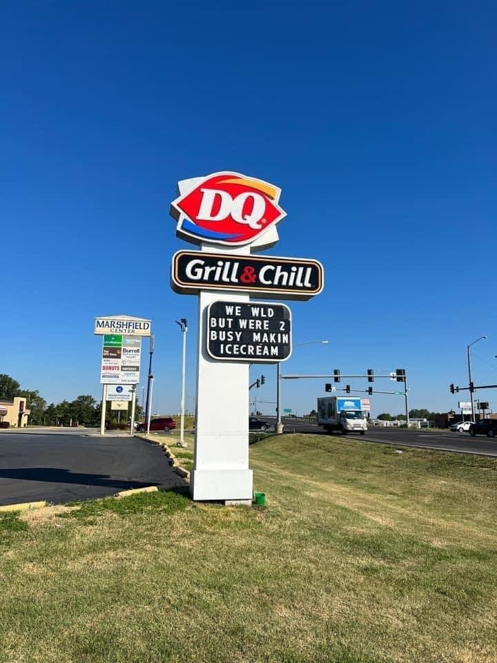 Dairy Queen's sign reads "We would, but we're too busy making ice cream"