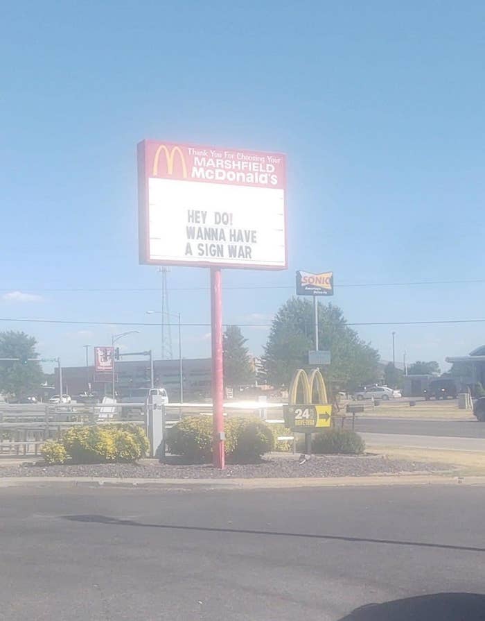 McDonald's sign says "Hey DQ! Wanna have a sign war"