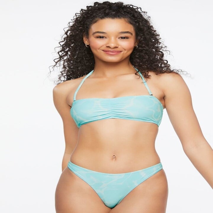 model wearing a light blue patterned bikini