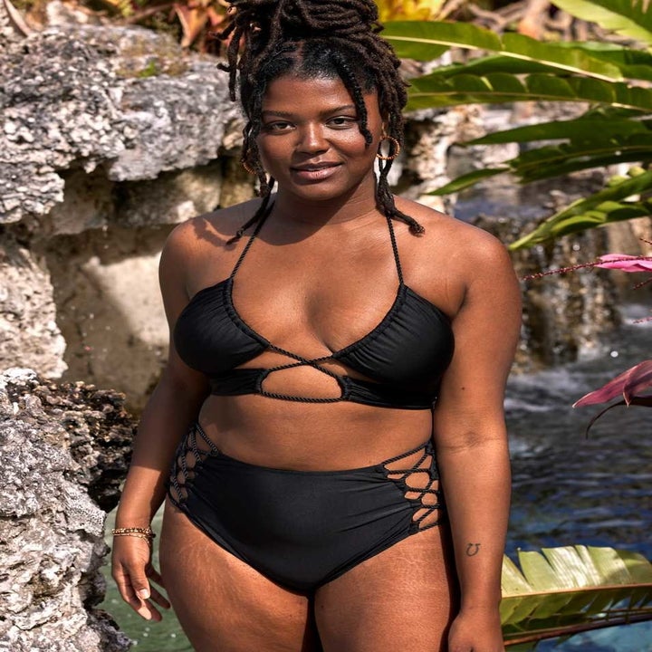 model wearing strappy black bikini set