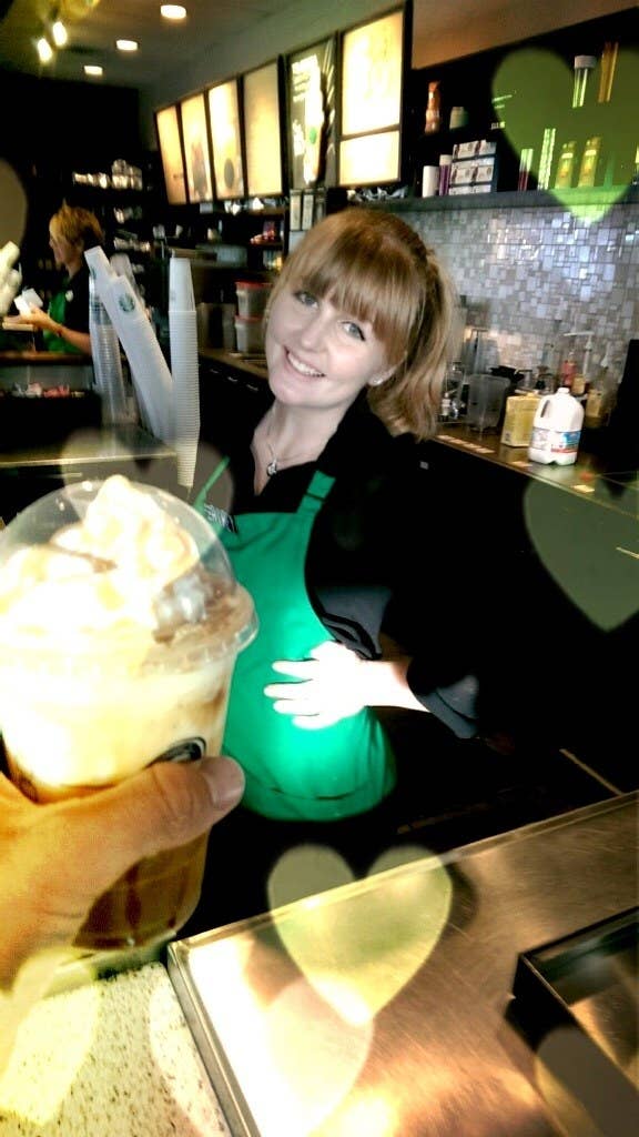 a barista smiling