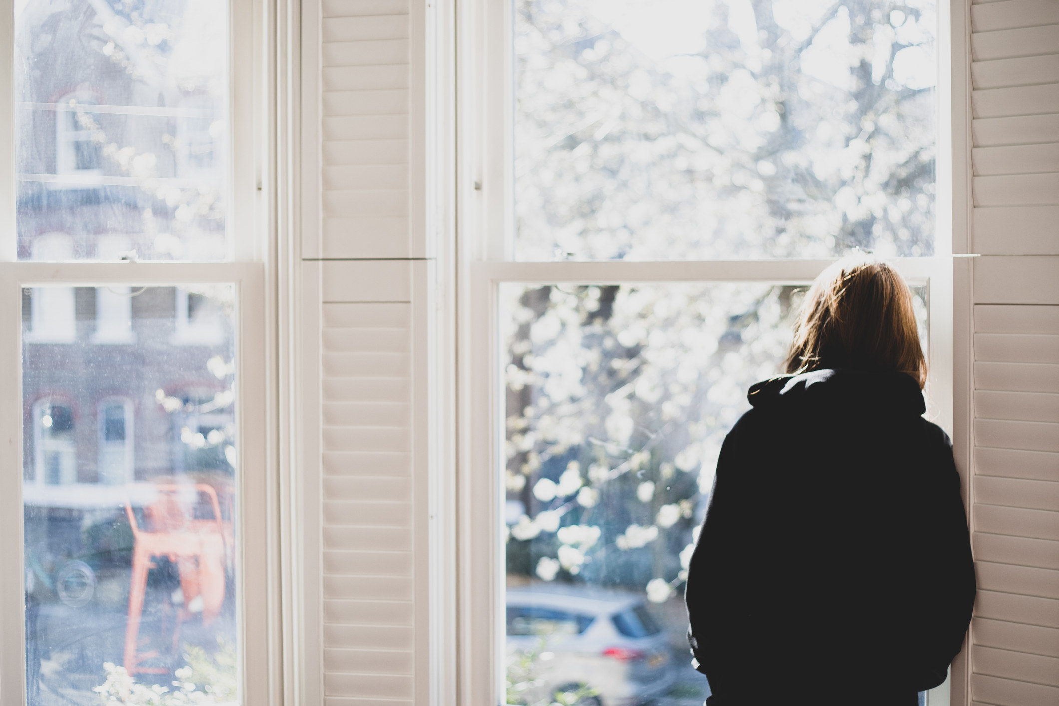 A woman staring out a window