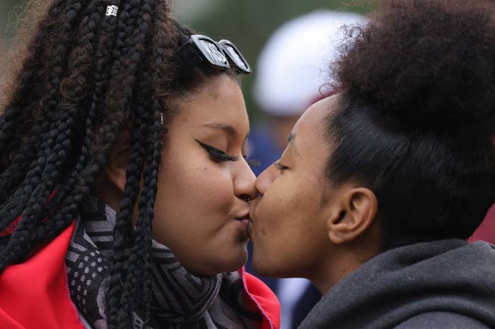 A couple kiss during an LGBTQIA+ parade in Porto Alegre, Brazil, on July 17, 2022