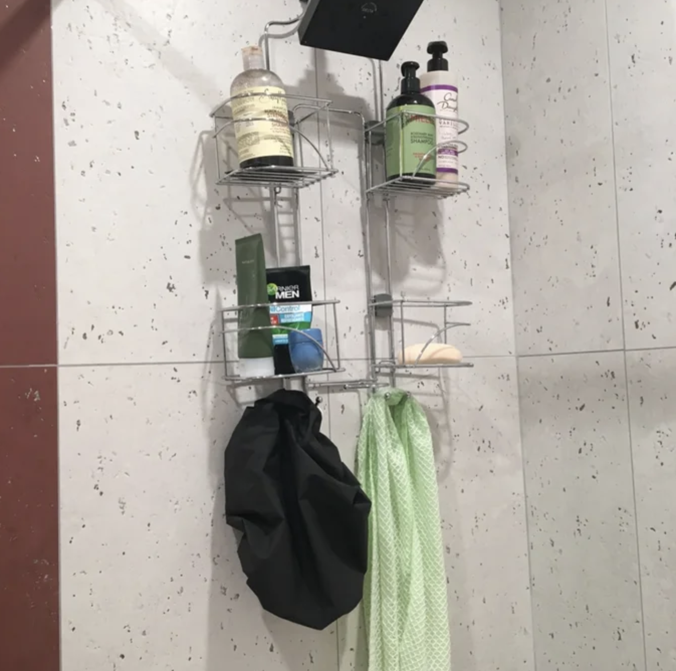 reviewer image of the caddy hanging on a shower