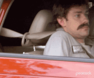 A gif of Jim from the Office reclining the seat in a car to hide