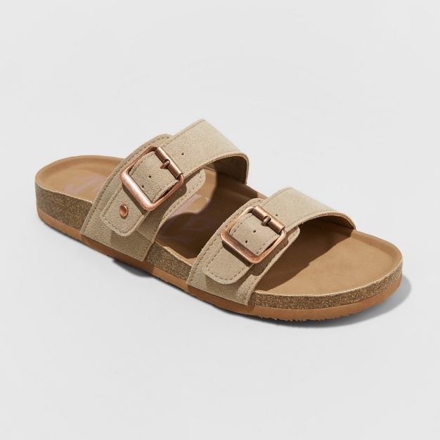 The taupe sandals have two large suede-like straps with bronze buckles