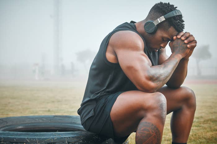 An athlete that appears to be praying