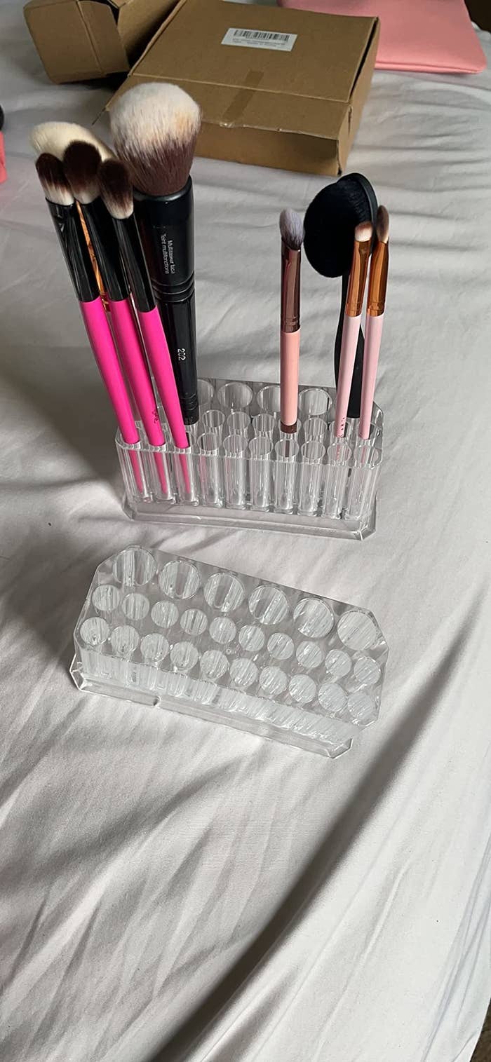 a reviewer&#x27;s makeup brushes in the brush holder