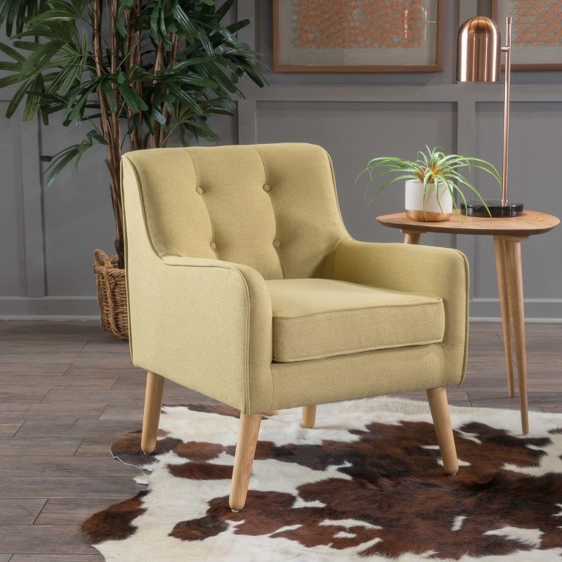 Wasabi green mid-century armchair with tufted back