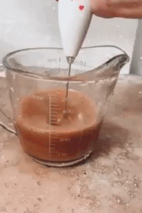 gif of a reviewer using the frother