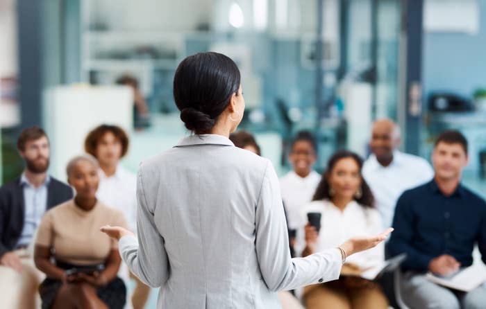 woman giving a presentation in an office