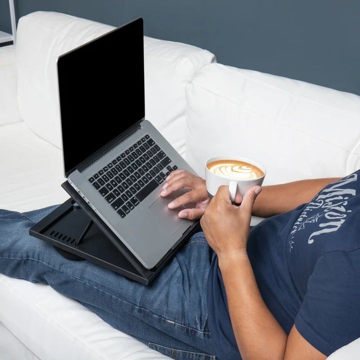 A model using the lap desk with a laptop computer