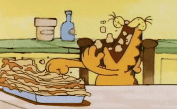 Garfield the cat shoveling lasagna into his mouth