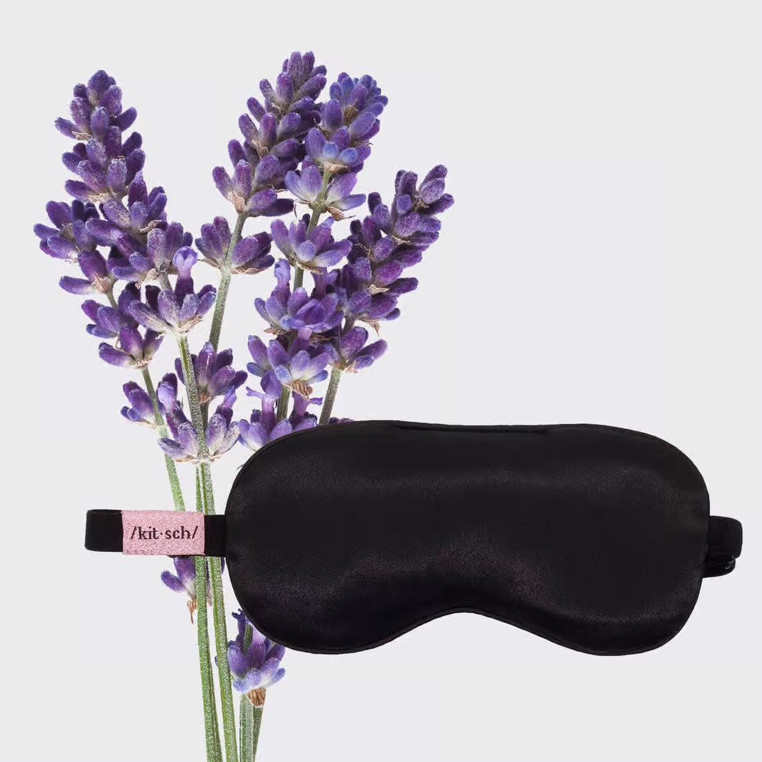 The sleeping mask against a lavender plant
