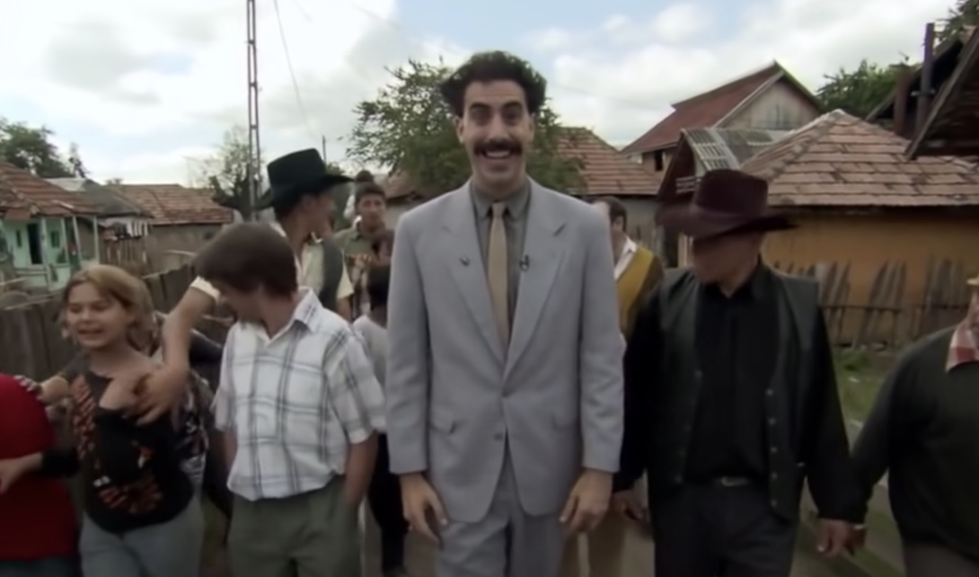 Borat walks with townspeople