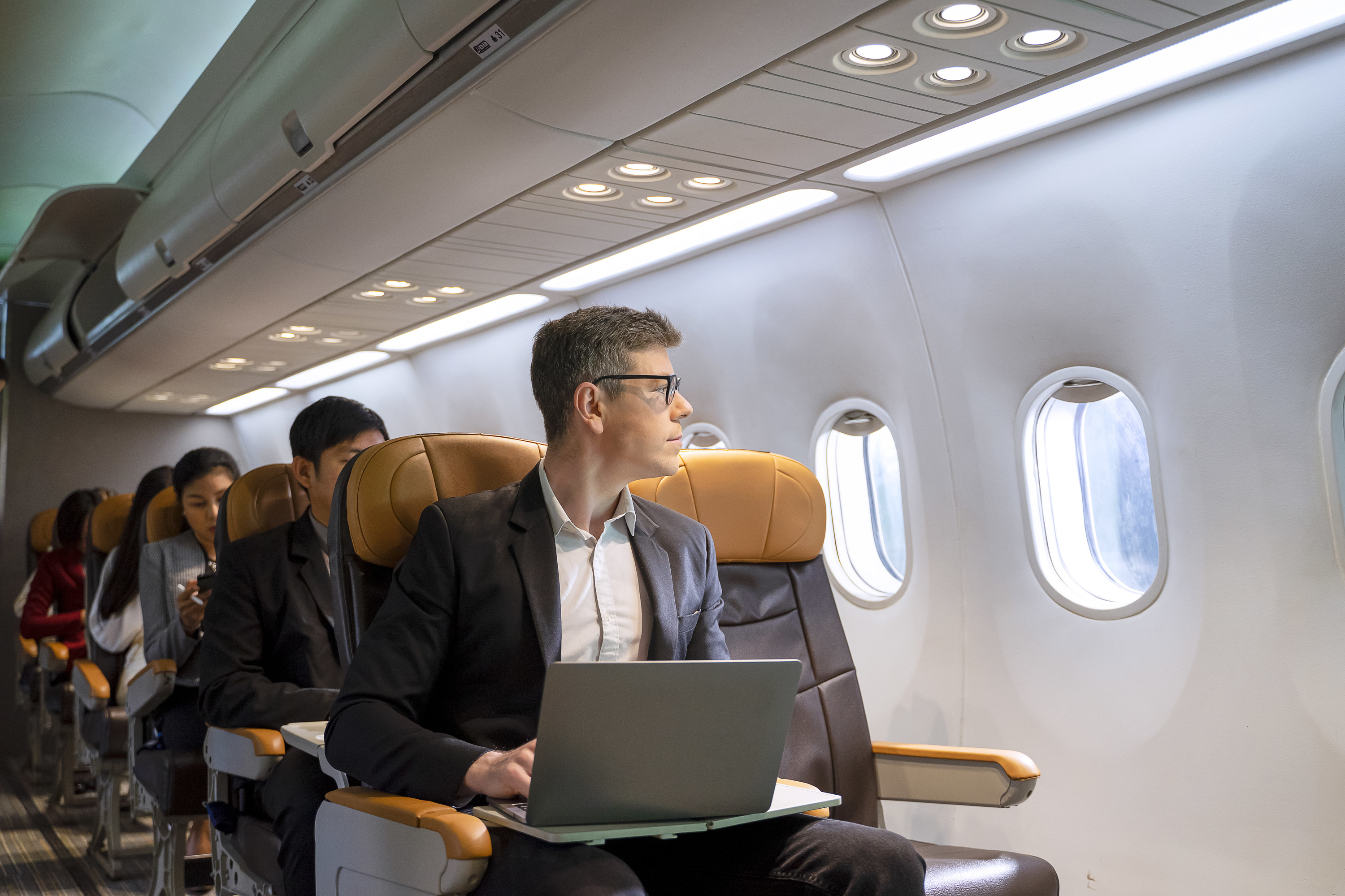 a person sitting in an exit row