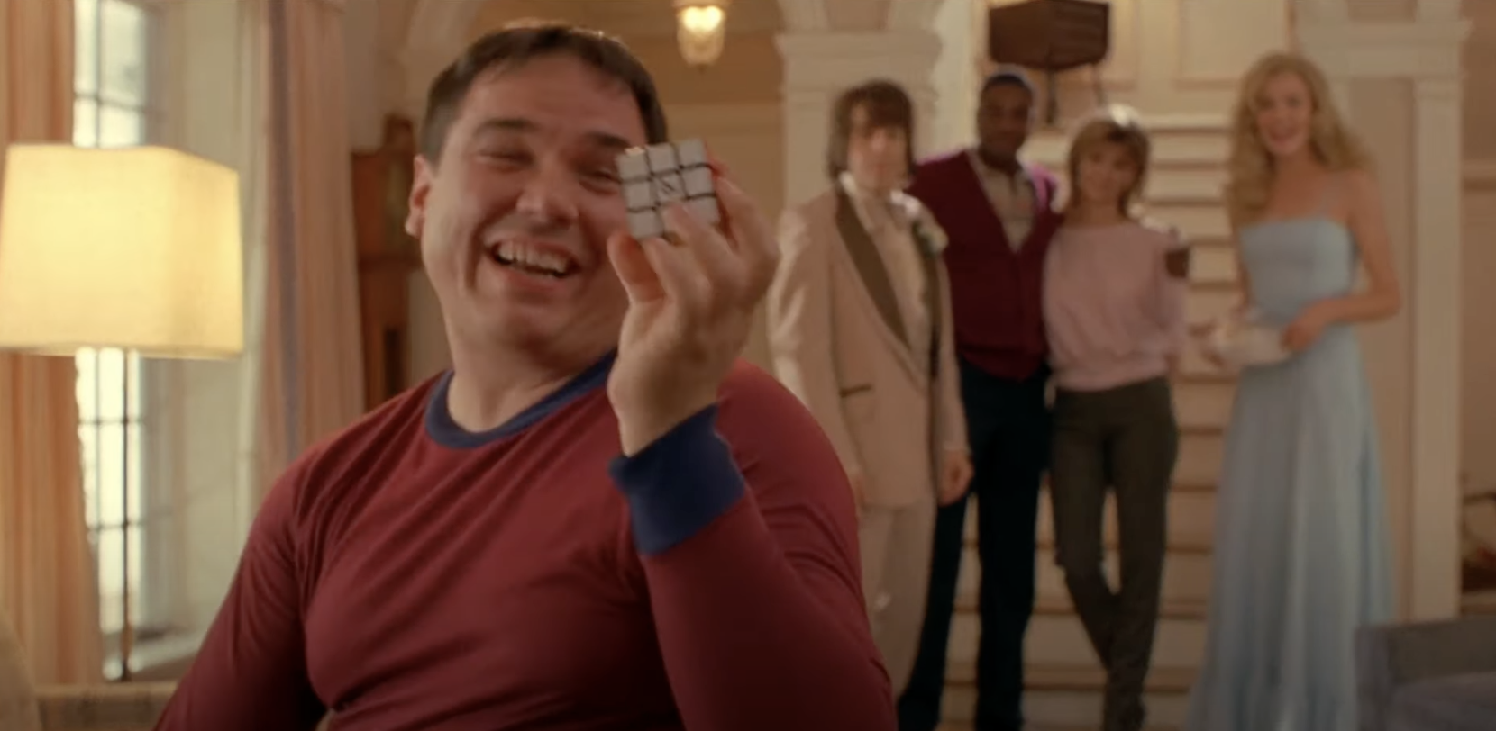 Warren holds a solved Rubix cube