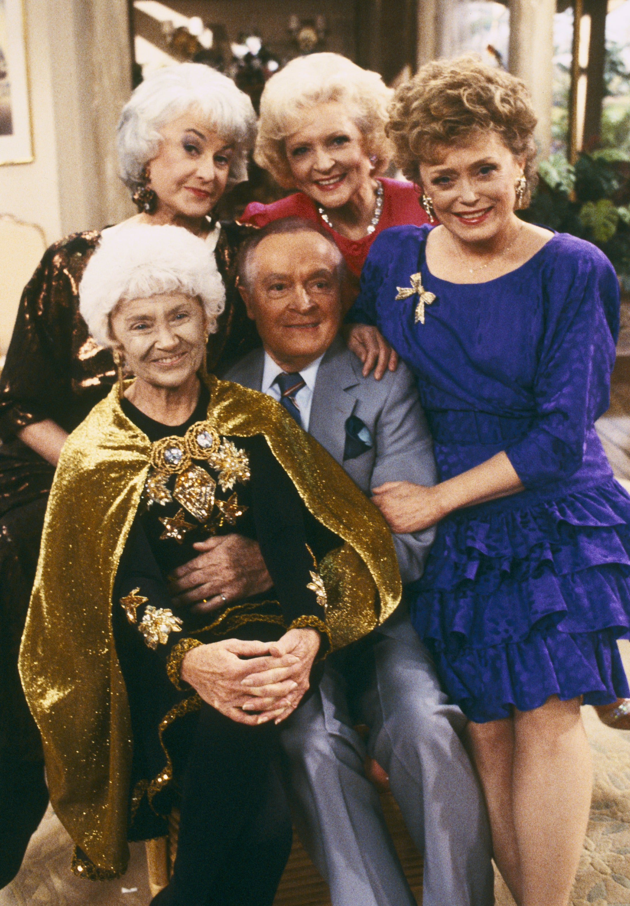 Bea Arthur, Betty White, Rue McClanahan, Estelle Getty, and Bob Hope are pictured on the set of &quot;The Golden Girls&quot;