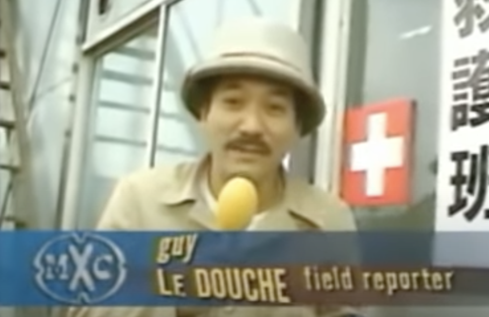 A reporter with the title &quot;guy le douche&quot;