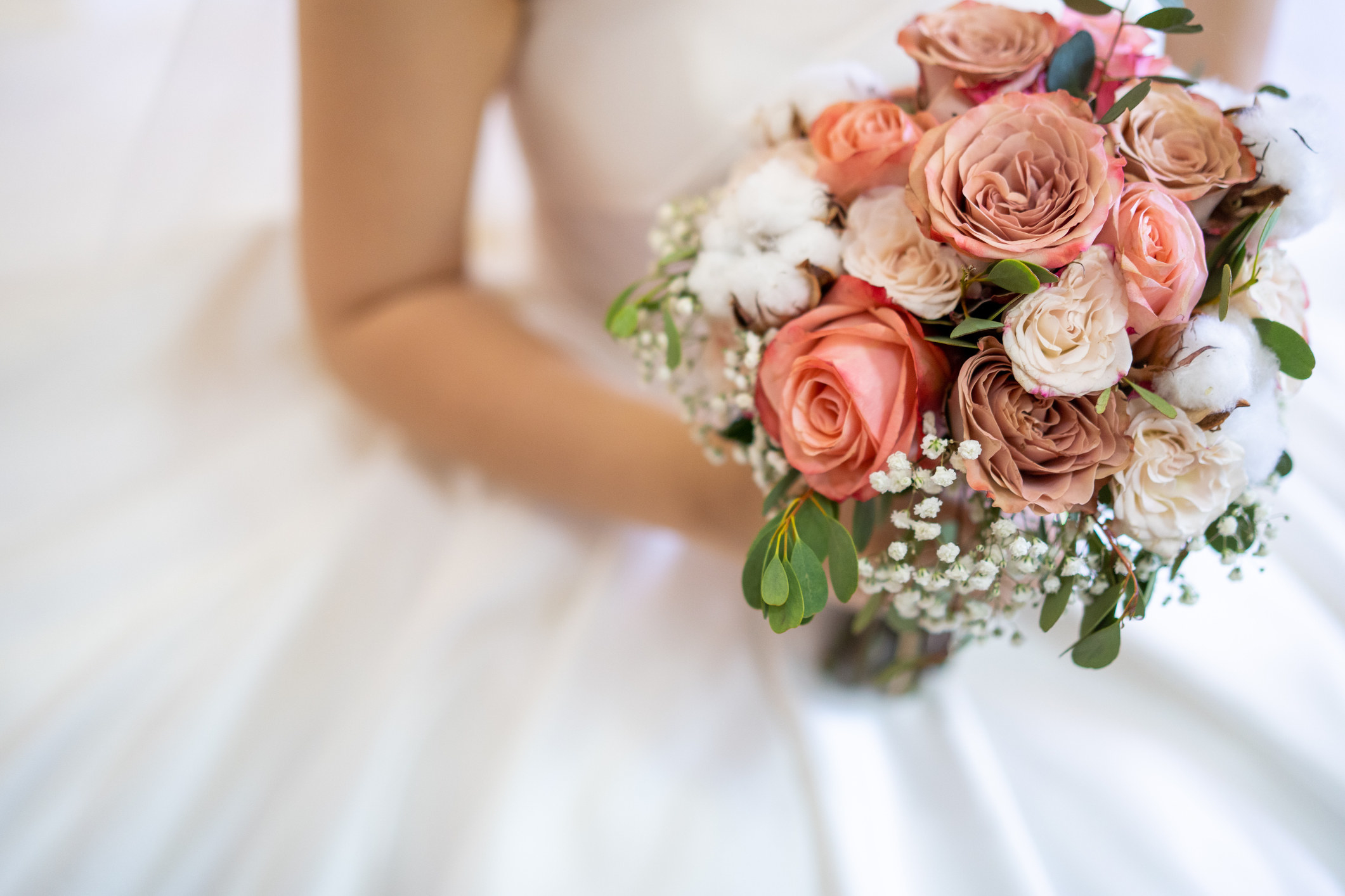 A bride holds a wedding bouquet