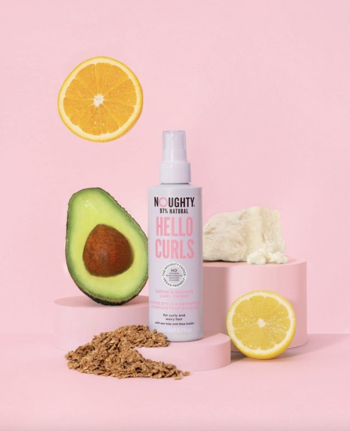 A curl primer with sliced lemon, avocado, a chunk of shea butter, and wheat
