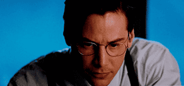 GIF of Keanu Reeves in the Devil&#x27;s Advocate, looking up